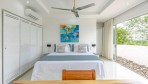 557-The beautiful second bedroom with king size bed and view on the swimming pool