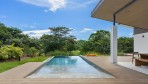 10996-The swimming pool of the brand new home for sale with views of the golf course of Reserva Conchal in Costa Rica