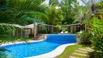 12258-The lovely swimming pool and its waterfall
