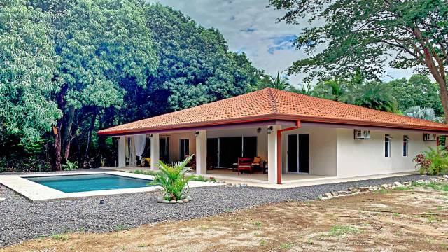 Within minutes of Tamarindo, one-story home for sale with a swimming pool.